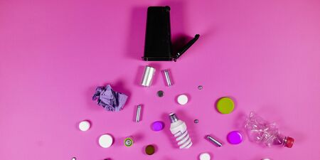 Trash bins and assorted garbage isolated on green, recycle concept, Top viewの写真素材