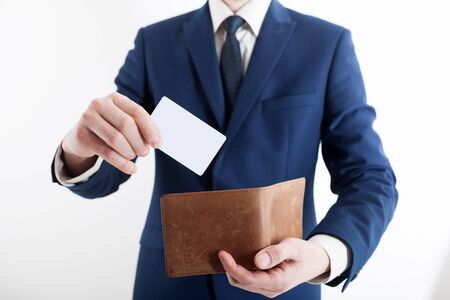 Man in suit with wallet and credit card.の写真素材
