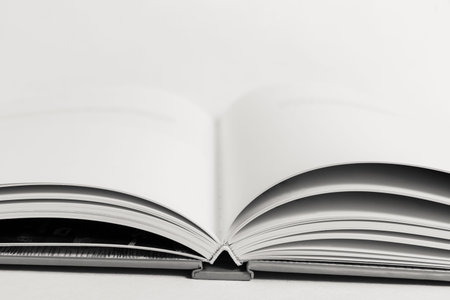 An open book on a table. Copy space