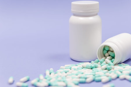 White pill on a wooden background with copy space. Global healthcare concept. Pharmaceutical...
