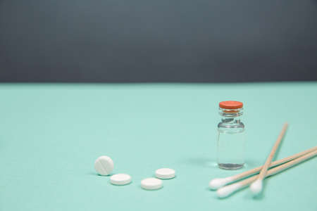 White pill on a wooden background with copy space. Global healthcare concept. Pharmaceutical industry. Pharmacy.の写真素材