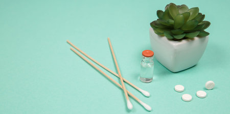 White pill on a wooden background with copy space. Global healthcare concept. Pharmaceutical...