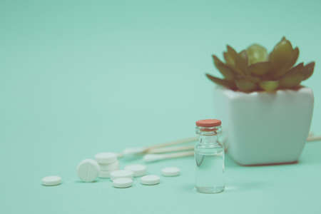 White pill on a wooden background with copy space. Global healthcare concept. Pharmaceutical industry. Pharmacy.の写真素材