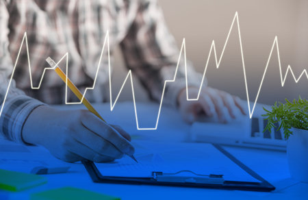 Closeup of a man checking accounts. Stock market chart and finger pointing on tablet in office with...