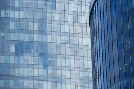 Steel light blue background of glass high rise building skyscraper commercial modern city of future. Business concept of success industry tech architecture.の写真素材