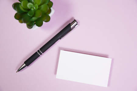 Office supplies in the pink workspace. Top view with copy space for input the text. Designer workspace on desk table essential elements on flat layの写真素材