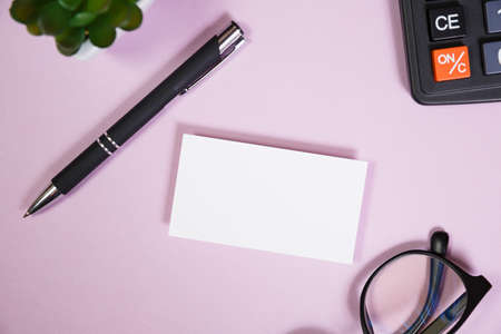 Office supplies in the pink workspace. Top view with copy space for input the text. Designer workspace on desk table essential elements on flat layの写真素材