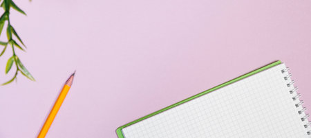 Office supplies in the pink workspace. Top view with copy space for input the text. Designer workspace on desk table essential elements on flat layの写真素材