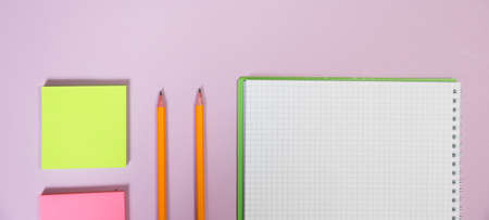 Office supplies in the pink workspace. Top view with copy space for input the text. Designer workspace on desk table essential elements on flat layの写真素材