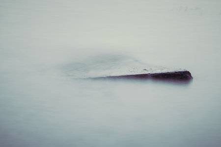 Beautiful stream flowing in motion. Natural background. Toning an imageの写真素材