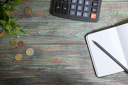 Office supplies in the wooden workspace. Top view with copy space for input the text. Designer workspace on desk table essential elements on flat layの写真素材