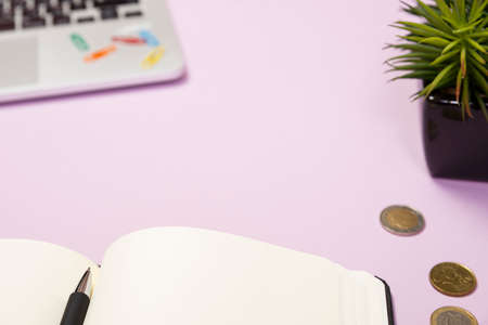 Office supplies in the pink workspace. Top view with copy space for input the text. Designer workspace on desk table essential elements on flat layの写真素材