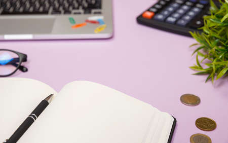 Office supplies in the pink workspace. Top view with copy space for input the text. Designer workspace on desk table essential elements on flat layの写真素材