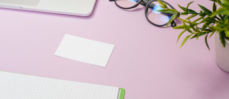 Office supplies in the pink workspace. Top view with copy space for input the text. Designer workspace on desk table essential elements on flat layの写真素材