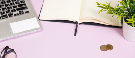 Office supplies in the pink workspace. Top view with copy space for input the text. Designer...