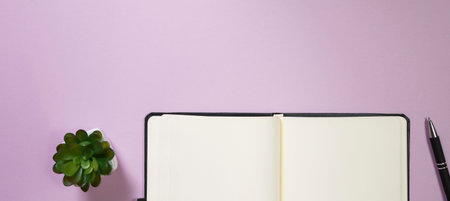 Office supplies in the pink workspace. Top view with copy space for input the text. Designer...