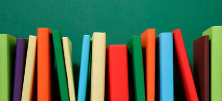 Composition with vintage old hardback books, colored background. Books stacking. Back to school. Copy Space. Education background.の写真素材