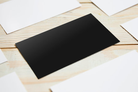 Business cards blank. White and black mockup on wooden background. Flat Lay. copy space for text