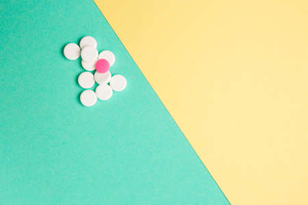 White and pink medicines on a colored double backgroundの写真素材