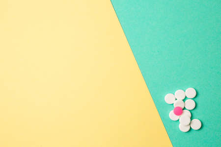 White and pink medicines on a colored double backgroundの写真素材