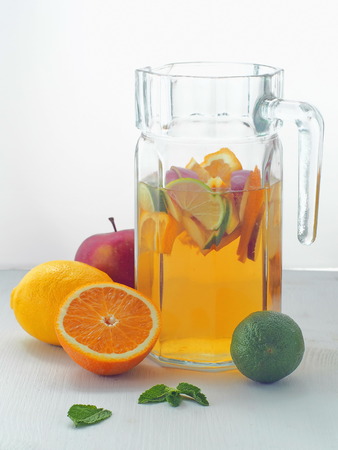 Cold fresh lemonade drink. Refreshing summer sangria. Homemade punch with fresh fruits and mint leaves.の写真素材