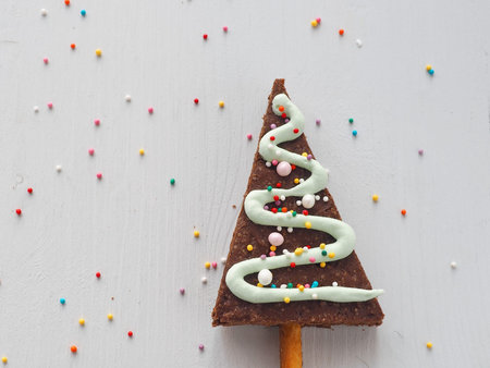 Triangle brownie decorated as Christmas tree. Homemade Christmas pastry. Copy space for your text....