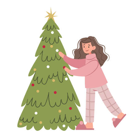 The girl in pink pajamas decorates a Christmas tree. Festive mood. Christmas. Childhood.のイラスト素材