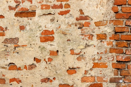 Brick wall background,texture concrete plaster on a brick wallの写真素材