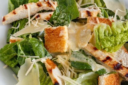 Caesar salad with chicken, lettuce and cheeseの写真素材