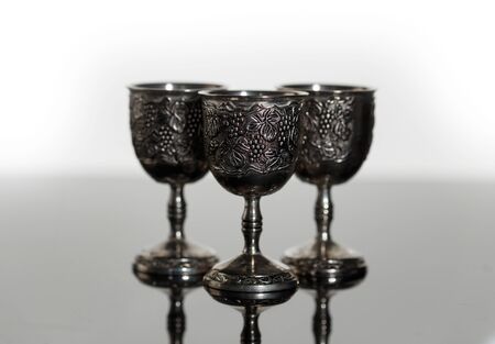 Glass metal with an engraved pattern on a light background with local focusの写真素材