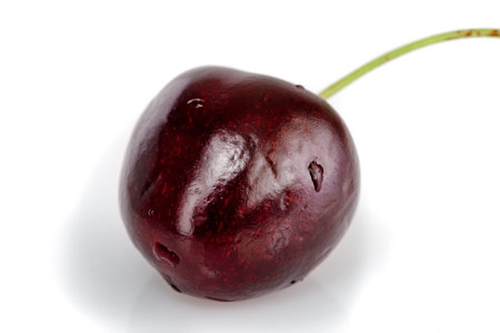 Berry of ripe cherries cherry red on a light background close up
