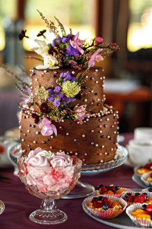 Two-tiered chocolate cake on the holiday table