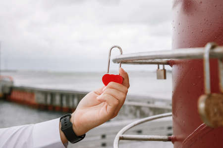 The bride and groom locks. Newlyweds hang the lock symbolizing everlasting love on the wedding day.の写真素材