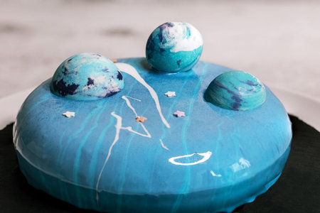 Cosmos style blue mousse cake with blue chocolate balls