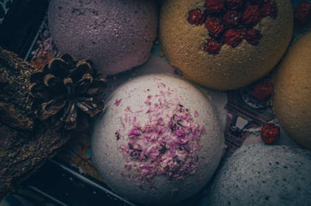 Background image with a spiral bomb for the bath. Focus on the light part of the hemisphere with micro flower petalsの写真素材