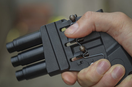 Self-defense weapons in hand. Extractor of pepper tear mixture.の写真素材