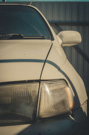 Toyota Corona from 1991. An old Japanese car. The front of the car is close-up. Color toningのeditorial素材