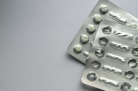 Tablets for colds on a gray background with copy space. Medicines. Means of treatment of diseases.の写真素材