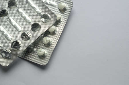 Tablets for colds on a gray background with copy space. Medicines. Means of treatment of diseases.の写真素材