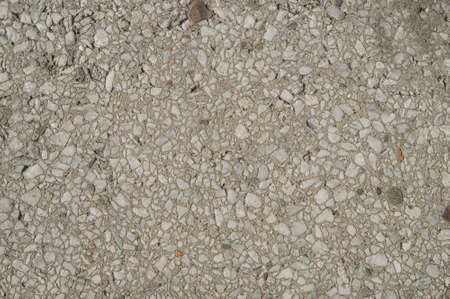 The texture of the old concrete pavement. Inclusions of small stones in the concrete floor.の写真素材