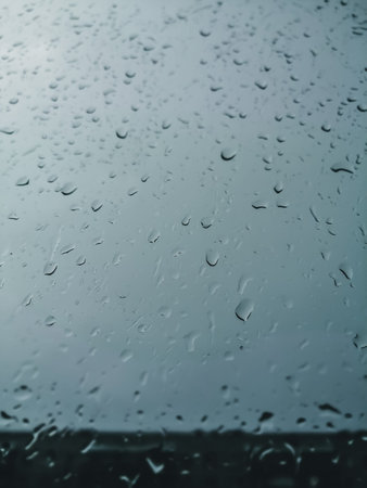 Raindrops on the window glass. Background. Selective focus, blur, defocused