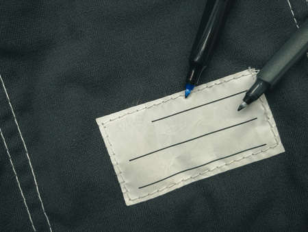 Patch on work clothes to write the name of the owner. Close-up of a clean name patch. Name tagの写真素材