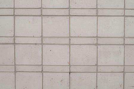 Abstract background of tile cladding of the facade of the building. Grey decorative tiles.の写真素材