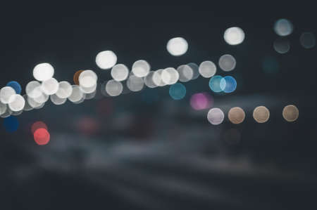 Defocused bokeh lights of the railway station at night. Abstract backgroundの写真素材