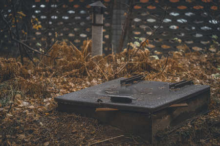 Cellar hatch in the ground. Place of storage of vegetables and stocks for the winter. Emergency shelter.の写真素材