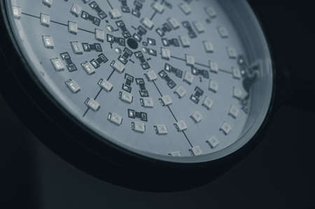 Close-up of the round panel of phytolamps for night illumination of plants. Electronic components on a circuit board. Selective focusの写真素材