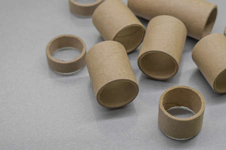 Cardboard spools for winding. Reels made of cardboard. Background of cardboard bobbins. Selective focusの写真素材