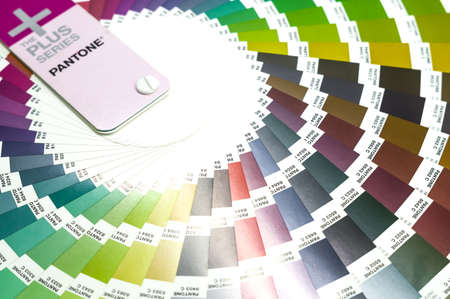 Berdsk, Russia - November 26, 2021: Pantone color palette. A sample of the chromaticity of the Pantone guide. Catalog of color samples. Selective focusのeditorial素材