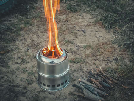 Mini camping stove. Tourist equipment for cooking. Selective focus, copy spaceの写真素材
