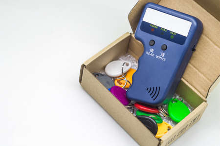 Magnetic key programmer. Duplicator for intercom keys. Electronic equipment for small businesses. Selective focus, copy spaceの写真素材